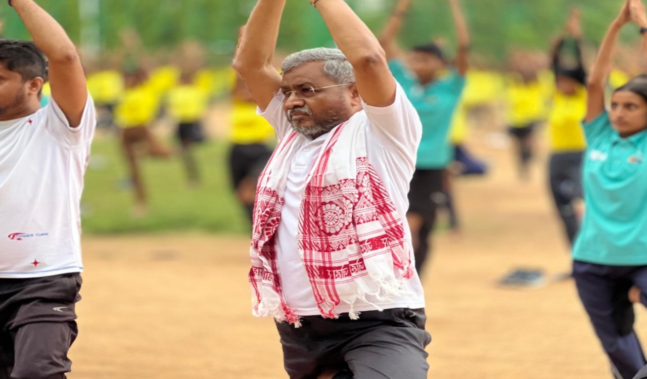 Babulal Marandi practiced yoga with children on International Yoga Day.
