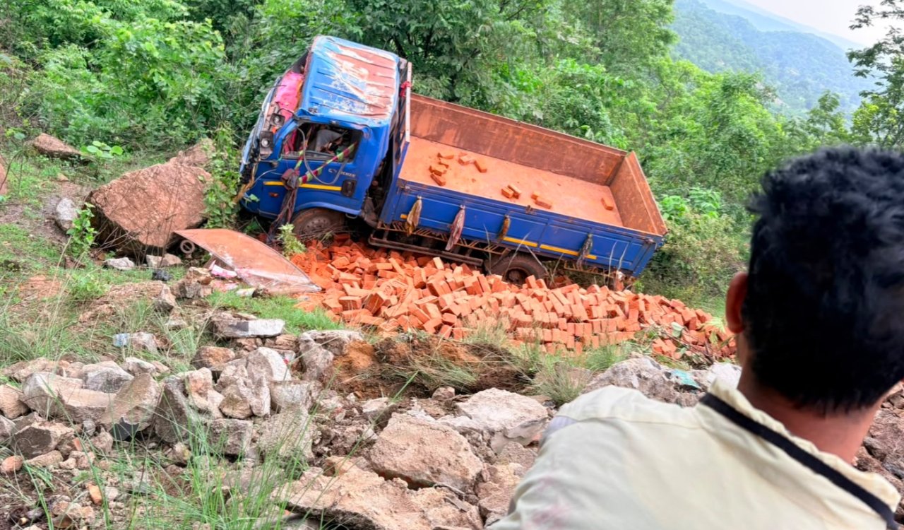 Brick-laden truck crashes in Pithoria Valley; driver flees, helper injured.