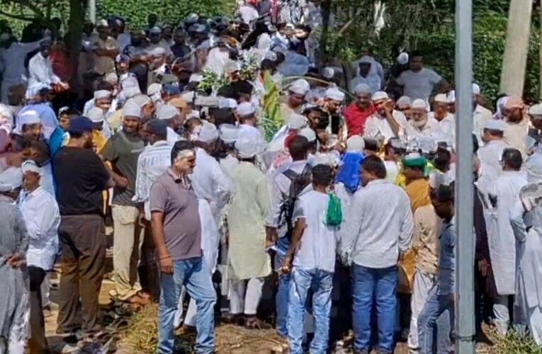 Former Minister Mannan Mallick laid to rest with state honors; massive crowd gathers at Shamsher Nagar graveyard.