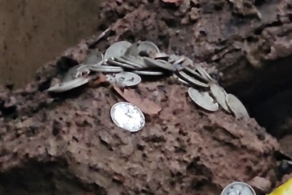 200-year-old house collapses in the rain; 'treasure' of over 300 silver coins found in the debris; stirs curiosity in the village.