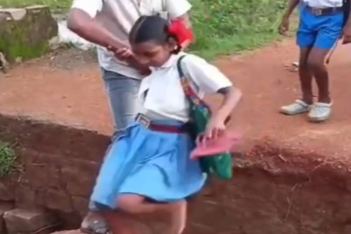 Children forced to use a broken culvert to get to school daily; villagers concerned about the risk of accidents.