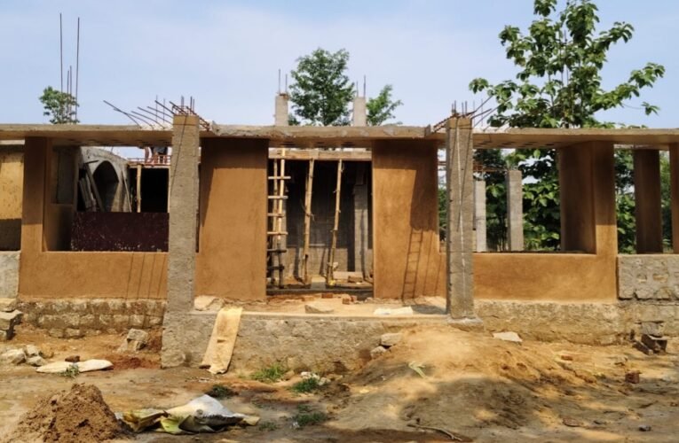 An 80-year-old mother's final dream lies within unfinished walls—the hope for a roof of her own on her native soil—with her future home stalled by a land dispute.
