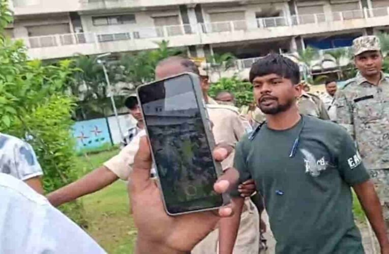 Youth climbs mobile tower near Jaipal Singh Munda Stadium amidst JPSC protest.