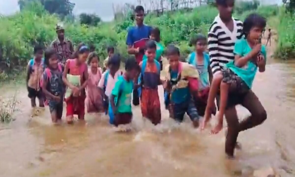 Children's journey to school across a swollen river in Chatra.