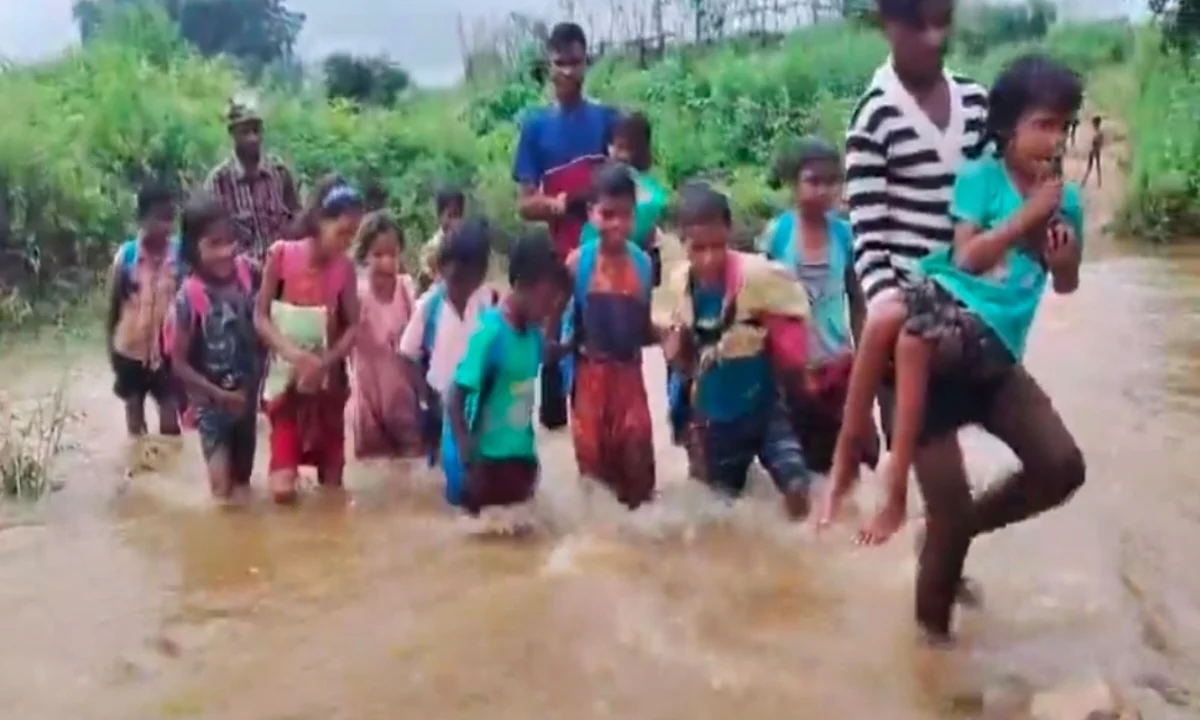 Children's journey to school across a swollen river in Chatra.