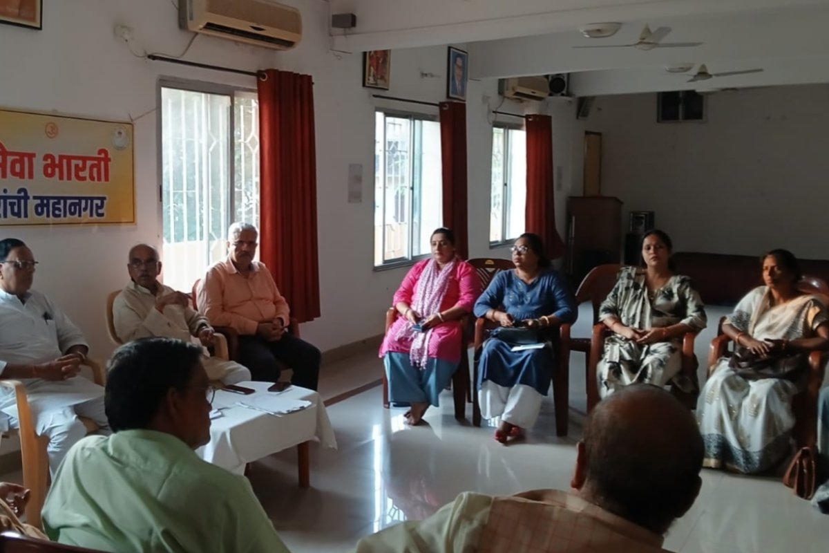 Preparations for the inauguration ceremony discussed at the Seva Bharati meeting; responsibilities assigned to volunteers.